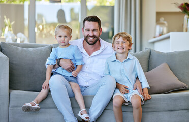 Poster - Bonding with dad. Cropped portrait of a handsome mature man sitting on the sofa at home with his son and daughter.