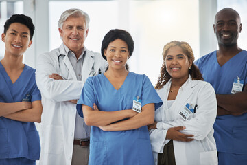 Sticker - Merging their expertise and skills to overcome complex cases. Portrait of a group of medical practitioners standing together with their arms crossed in a hospital.