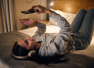 Poster - I couldnt sleep.... Cropped shot of an attractive young woman making a video call while lying in her bedroom at home late at night.