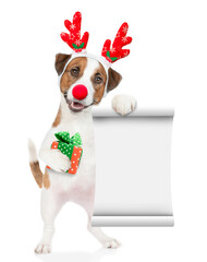 Aufkleber - Jack russell terrier puppy dressed like santa claus reindeer  Rudolf holding gift box and showing empty list. isolated on white background