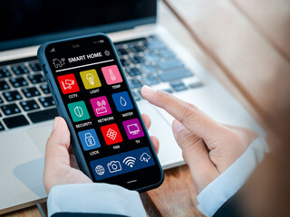 Aufkleber - Smart home applications technology on smartphone holding in hand. Smart house app screen on mobile phone for wireless remote connection control using by business person who working with computer.