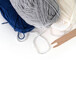 The layout of the tools for weaving and weaving on a white background. Wool yarn and shuttle. View from above. Banner, background