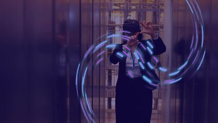 Poster - Animation of glowing light trails of data transfer over caucasian woman in vr headset
