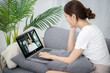 © Charlie's - Asian Businesswoman VDO Call Conference Work  talk chat online  video call on laptop webcam conference working with laptop online briefing E learning and social distancing concept.