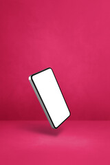 Poster - Floating smartphone isolated on pink. Vertical background