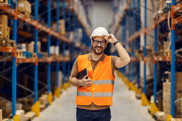 Wall Mural - A distribution center supervisor holds tablet under armpit and greets visitors.