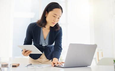 Poster - Tablet, focus and laptop with business woman in office for planning, online report and email. Technology, communication and connection with asian female employee for corporate, idea and review