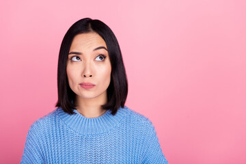 Poster - Portrait of minded pensive girl look interested empty space ponder isolated on pink color background