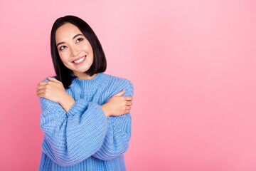 Poster - Photo of cute positive girl toothy smile hands hug shoulders look empty space isolated on pink color background