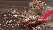 Mixed Dry Organic Cereal And Grain Seed Pile On Wooden Background. For Healthy Food Ingredient Or Carbohydrate Food Type And Agricultural Product Concept.