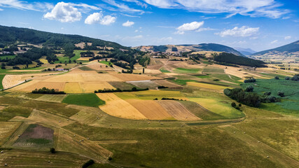 Wall Mural - Colfiorito, Umbria. Fields and crops. Play of colors seen from above.