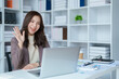 © Jirapong - Beautiful young teen asian business woman meeting at on computer laptop with planning working on financial document, tax, exchange, accounting and Financial advisor