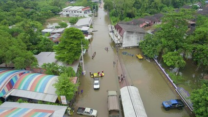 Wall Mural - High-angle view of the Great Flood, Meng District, Thailand, on October 3, 2023, is a photograph from real flooding. With a slight color adjustment