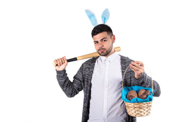 Young attractive student dressed as a rabbit on Easter holiday. Happy man.	