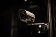Security surveillance camera mounted to a wall in a dark street. Generative AI