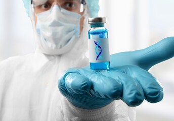 Wall Mural - Lab scientist holding bottle vial and DNA strand