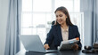 © Phushutter - Portrait of female asian lawyer manager in formal suit working with signed insurance contract law, legal, legislation, online consulting real estate clients close deal in realtor office.