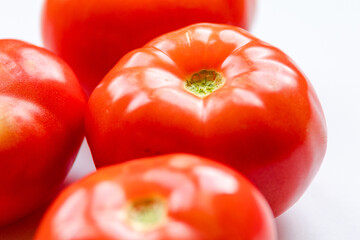 Wall Mural - bunch of red tomatoes close up on white background