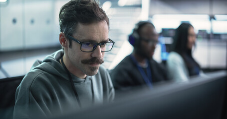 Poster - Close Up of a Software Developer Working on a Computer, Typing Programming Code on a Stylish Keyboard with Neon Backlight. Professional Employee Doing Work in a Cyber Security Technology Company