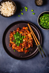 Wall Mural - Fried kimchi with pork onions and spices. Traditional Korean food