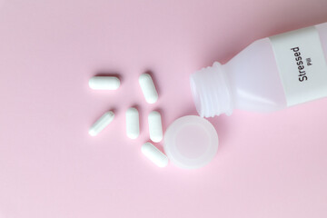 Poster - Stressed pill in white bottle, pill stock