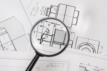 Wall Mural - engineering drawings of industrial parts and mechanism through a magnifying glass