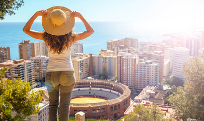 Poster - Woman looking at panoramic view of Malaga city in Spain