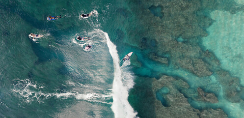 Surfer on the wave in Hawaii aerial