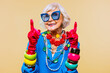 © oneinchpunch - Cool and stylish senior old woman with fashionable clothes - Elderly funny female with stylish colorful dress portrait on isolated colored background