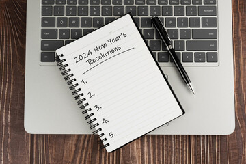 Wall Mural - Laptop and Notepad with text - 2024 New Year's Resolutions