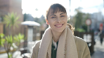 Sticker - Young caucasian woman smiling confident looking at the camera at coffee shop terrace