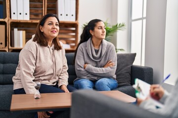 Canvas Print - Three woman mother and daughter having psychology therapy at psychology center