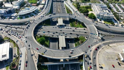 Wall Mural - Aerial drone video of ring road junction passing through Marousi residential area connecting Attiki odos highway and Kifisias Avenue, Attica, Greece