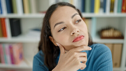 Poster - Young beautiful hispanic woman thinking at university classroom