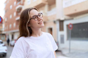 Young caucasian woman smiling confident wearing glasses at street