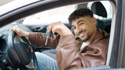 Sticker - Young arab man smiling confident holding key of new car at street