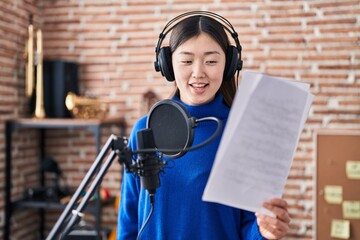 Wall Mural - Chinese woman artist singing song at music studio