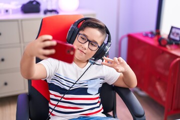 Sticker - Adorable hispanic boy streamer smiling confident make selfie by smartphone at gaming room