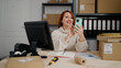 © Krakenimages.com - Young redhead woman ecommerce business worker using smartphone at office