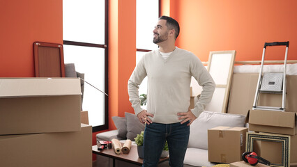 Sticker - Young hispanic man smiling confident standing at new home