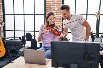 Poster - Man and woman musicians having online violin lesson at music studio