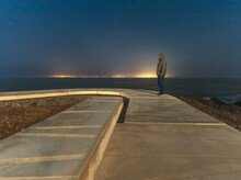 Night View Of The Lights Of Tenerife From The Sardina Lighthouse In Northwest Gran Canaria