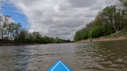 Wall Mural - River paddling race, Mean Lamine, on the Lamine River in Missouri. POV from a bow of a stand up paddleboard.