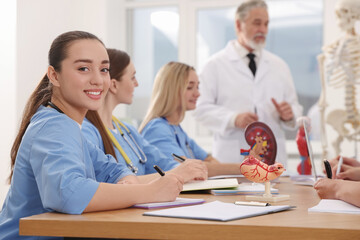 Sticker - Portrait of young intern wearing uniform on lecture in university