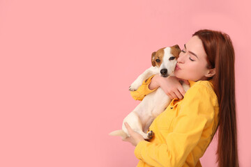 Sticker - Woman kissing her cute Jack Russell Terrier dog on pink background. Space for text