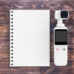 Fototapete - Pocket Handheld Gimbal Action Camera with Blank Note Pad. 3d Rendering