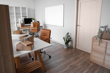 Sticker - Workplaces with cardboard boxes in office on moving day