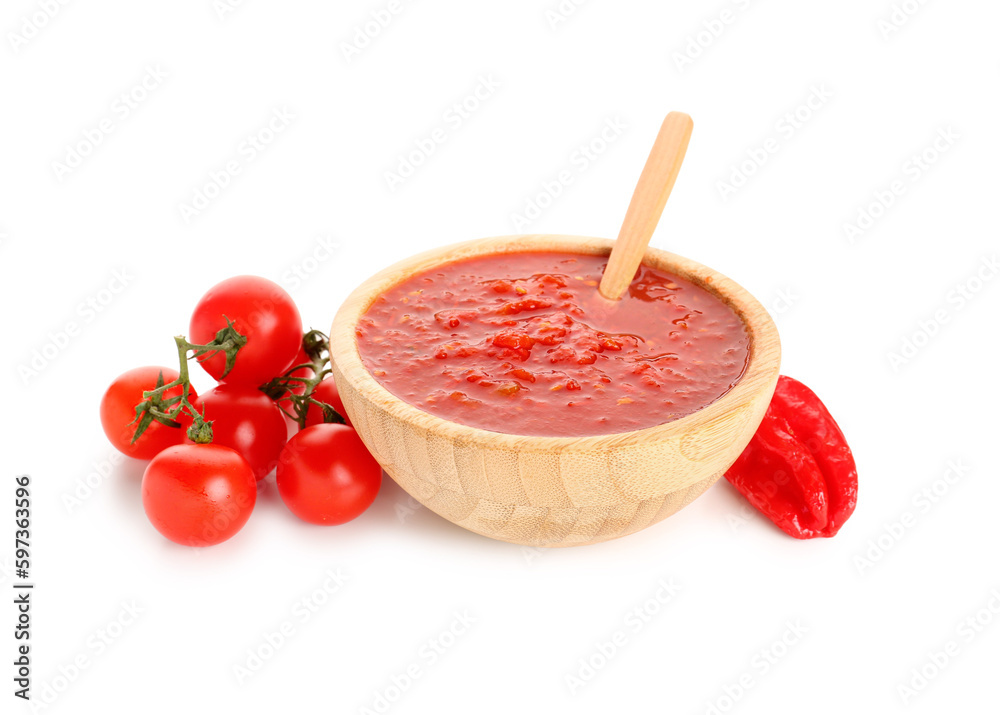 Bowl with tasty tomato sauce and fresh vegetables on white background