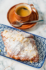 Wall Mural - almond croissant in the cafe