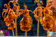 Grilled squid with Mala chilli on a stick at Muslim street food, China. Chinese food style.